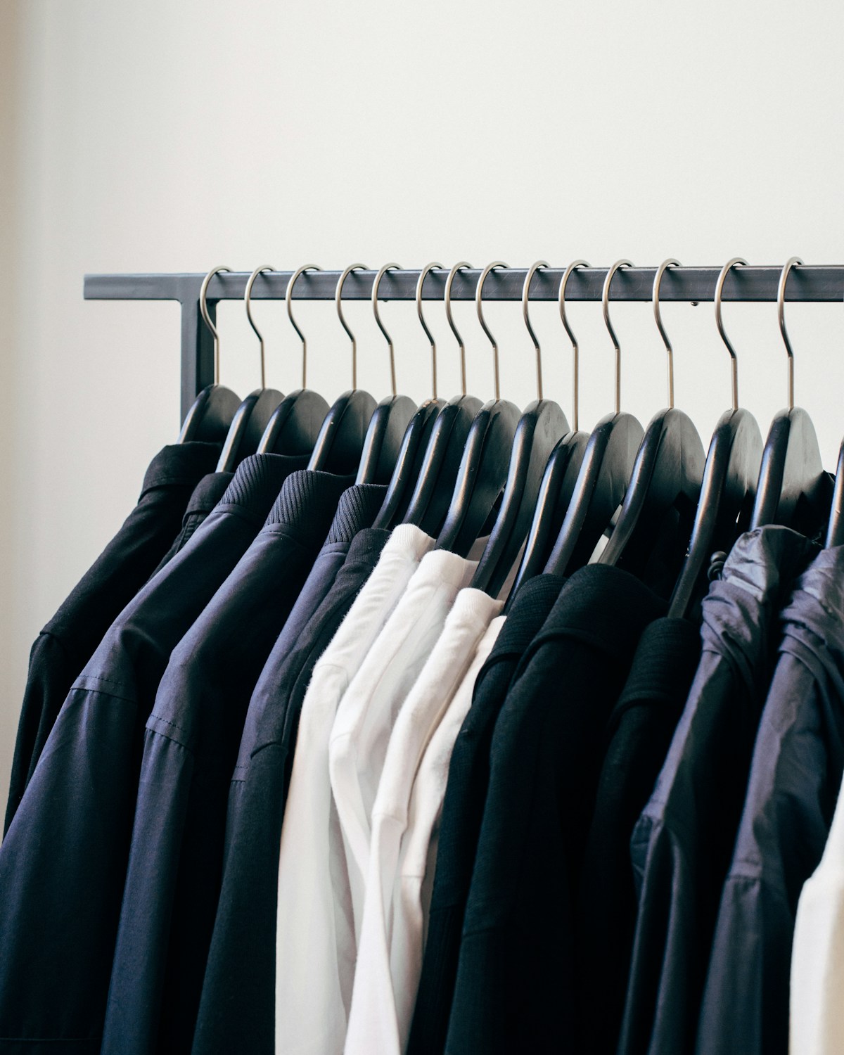 Boutique clothing rack under warm pendant lights
